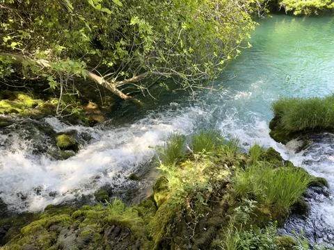 Fast moving small river in Croatia flowing cleaning during late spring seas.. Stock Photos