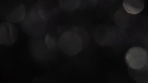Fast moving sparkling bokeh white bokeh in the dark 스톡 동영상 317537832