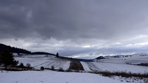 Fast moving storm clouds over agricultural fields Stock Footage 100184358