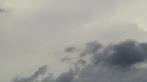 Fast moving stormy clouds gather in the afternoon sky during a weather event Stock Footage 340568478