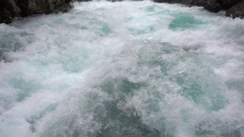 A fast-moving stream of the mountain river Video stock 72424786