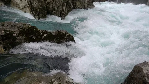 A fast-moving stream of the mountain river Stock Footage 72424792
