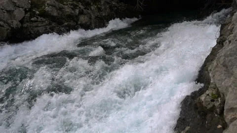 A fast-moving stream of the mountain river Stock Footage 100812278