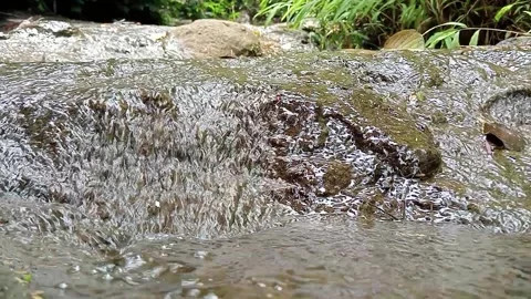 Fast Moving Stream Water Over Rough Rocky Surface Stock Footage 329782822