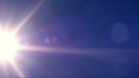 Fast moving sun across clear blue sky background Stock Footage 58796323