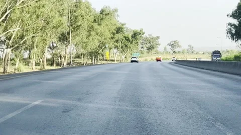 Fast moving traffic on motor way M2 in Islamabad, Pakistan on May 20, 2025. Stock Footage 310259007