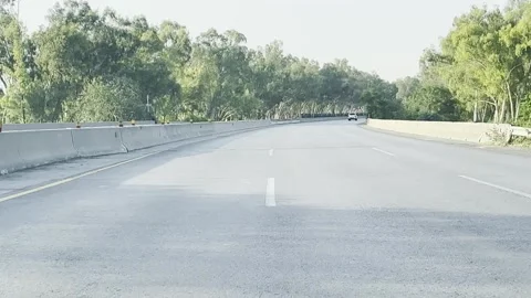 Fast moving traffic on motor way M2 in Islamabad, Pakistan on May 20, 2025. Stock Footage 310259153
