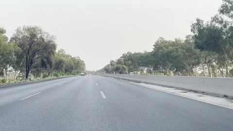 Fast moving traffic on motor way M2 in Islamabad, Pakistan on May 20, 2025. Stock Footage 310296319