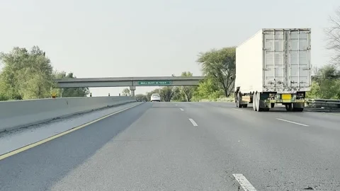 Fast moving traffic on motor way M2 in Islamabad, Pakistan on May 20, 2025. Stock-Footage 310299092