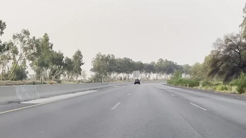 Fast moving traffic on motor way M2 in Islamabad, Pakistan on May 20, 2025. Stock Footage 310335779