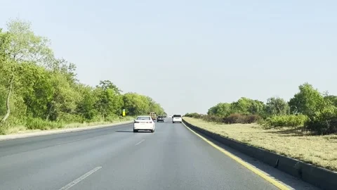 Fast moving traffic on motor way M2 in Islamabad, Pakistan on May 20, 2025. Stock Footage 310360751