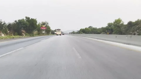 Fast moving traffic on motor way M2 in Islamabad, Pakistan on May 20, 2025. 스톡 동영상 310394789