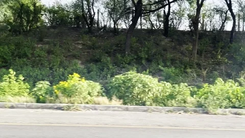 Fast moving traffic on motor way M2 in Islamabad, Pakistan on May 20, 2025. Video stock 310408501