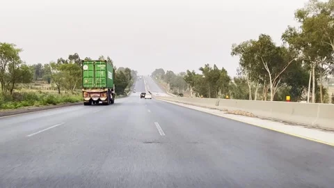 Fast moving traffic on motor way M2 in Islamabad, Pakistan on May 20, 2025. Stock Footage 310408973