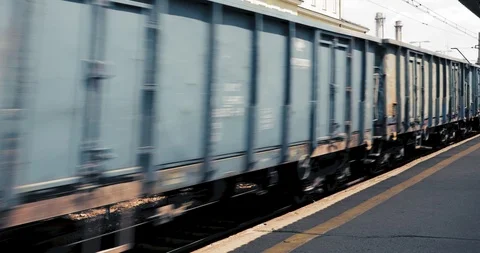 Fast moving train moving by in a fast motion Stock Footage 93634702