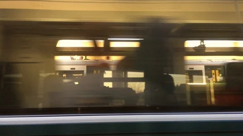 Fast moving train at the station from view of window Stock Footage 103842273