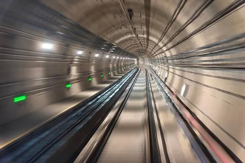 Fast moving train in subway Stock Photos