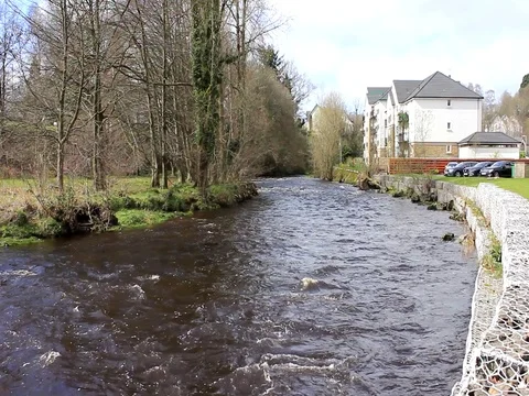 Fast moving water on a bend Stock Footage 74127813