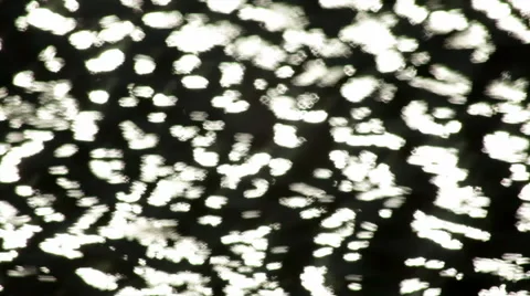 Fast moving water surface with shining sparkles. Видео 47012085