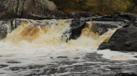 Fast moving waterfall rushing over large rocks Stock Footage 41997493