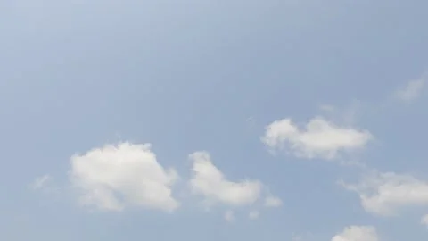 Fast moving white clouds on beautiful sunny clear blue sky background Stock Footage 153670615