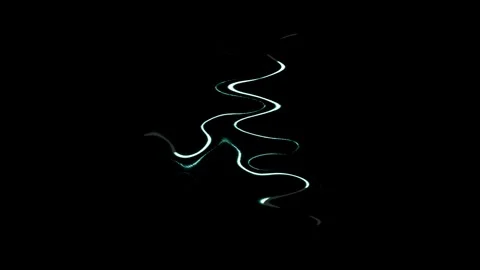 Fast-moving white wavy lights on a black background. Stock Footage 251314024
