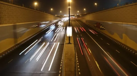 Fast non-stop night traffic at city highway moving down to underpass 스톡 동영상 59618583