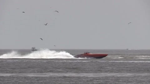Fast offshore boats going by in the background Stock Footage 51418074