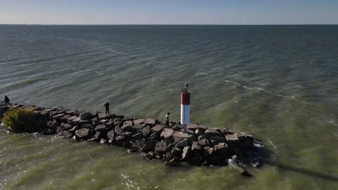Fast Orbit Around Navigation Beacon Light With People Stock Footage 139901053