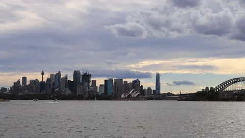 Fast overcast clouds  over Sydney city landmarks across harbour as 4k. Stock Footage 145558792