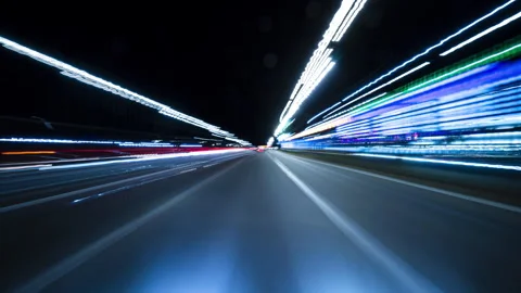 Fast-paced drive through a modern urban tunnel at night Stock Footage 345144415