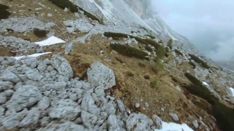 Fast-paced, first-person perspective of a rocky mountain descent. Stock Footage 295744663