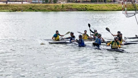 Fast Paced Kayak Polo Clash on Guadalquivir River Stock Footage 339090713