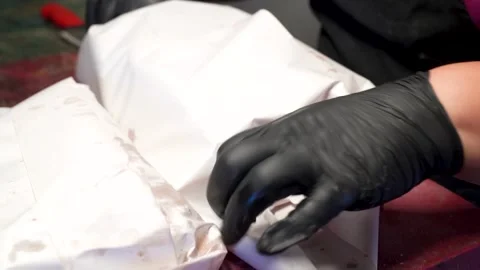 Fast-Paced Packaging of Turkish Pide by Chef Wearing Black Hygienic Gloves Stock Footage 323182907