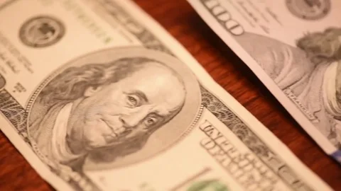 Fast pan hund dollar bills new and old Stock Footage 75763591