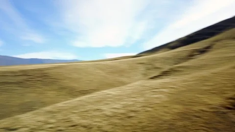 Fast panoramic view of valley with mountain background, cloudy day, aerial shot Stock Footage 89816132
