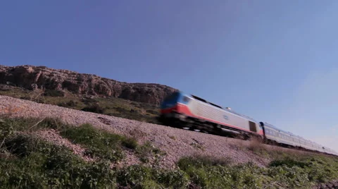 Fast passenger train passing through_low wide angle shot Vidéo 46011865