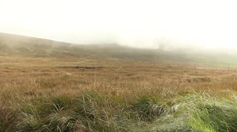 Fast passing clouds on top of misty mountains Stock Footage 45076061
