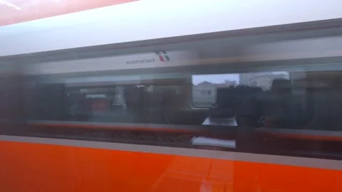 Fast Passing Frecciarossa Express Train with infrastructure background, Italy Stock Footage 142166549