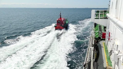 Fast pilot motor ship sails past tremendous tanker Onyx Stock Footage 118356818