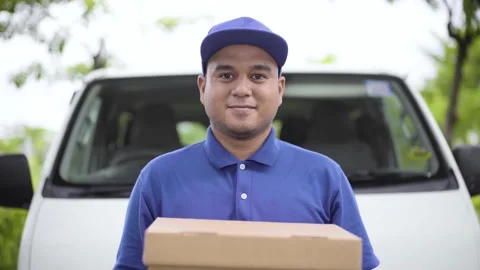 Fast post shipment service concept. Young asian deliveryman wear blue shirt hold Stock Footage 137437088