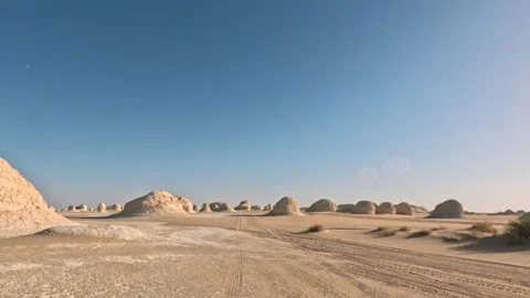Fast pov driving on the road in white desert with sand and rocks around. Vídeos de archivo 339525754
