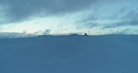 Fast reveal of winter wind power generation in the Arctic: Arial shot Stock Footage 152785863