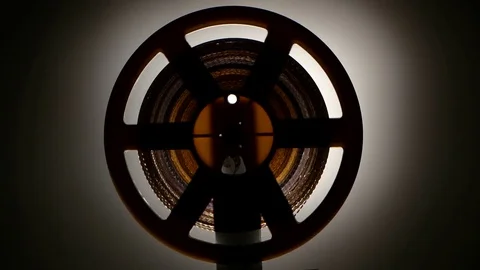 Fast rewind tape on the old retro cinema projector. Closeup Stock Footage 73660463