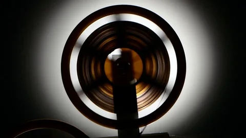 Fast rewind the tape on the old retro cinema projector Stock Footage 73662782