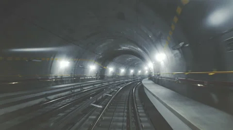 Fast ride of a train in a dark underground tunnel in the modern city Stock-Footage 60213558