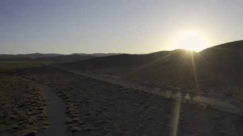Fast right panning shot over a road at sunset. Stock Footage 155251683