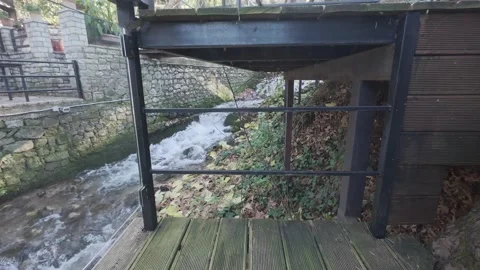 Fast River Flowing Through Traditional Greek Village Video stock 326353199