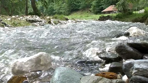 Fast river flowing trough rocks Stock Footage 102225820