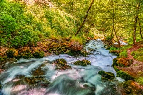 Fast river in mountains Stock Photos